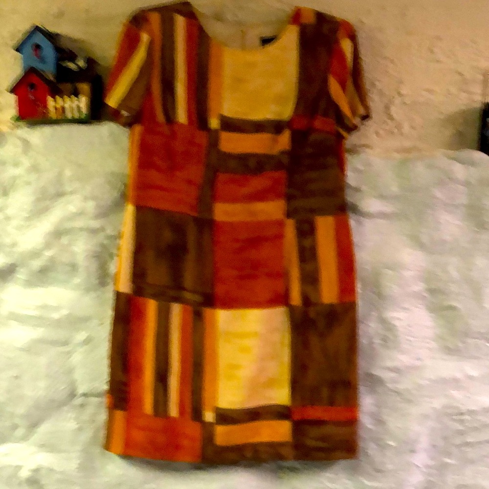 John Roberts zip back size 14 Polyester dress. Front pleats. Has slip attached.